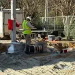 Photo of Kilowatt Electric team member pulling wires on a fuel renovation.